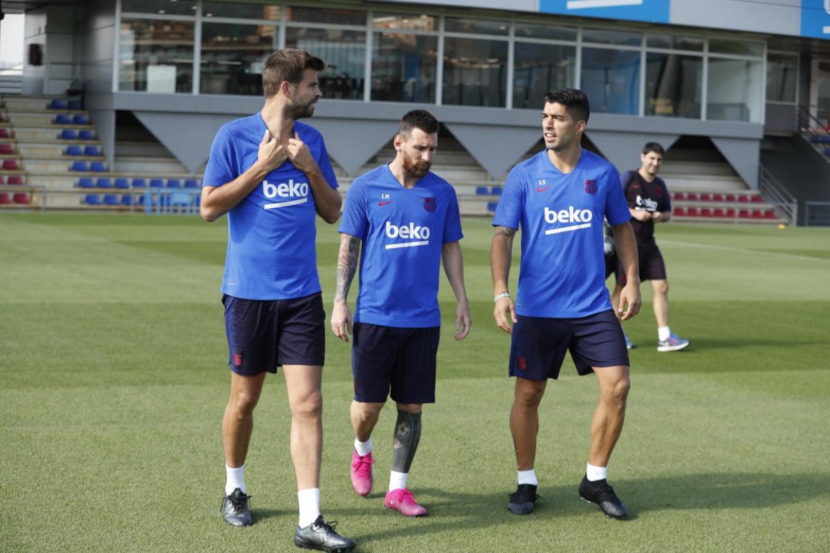 Piqué, Messi i Suárez en un entrenament.