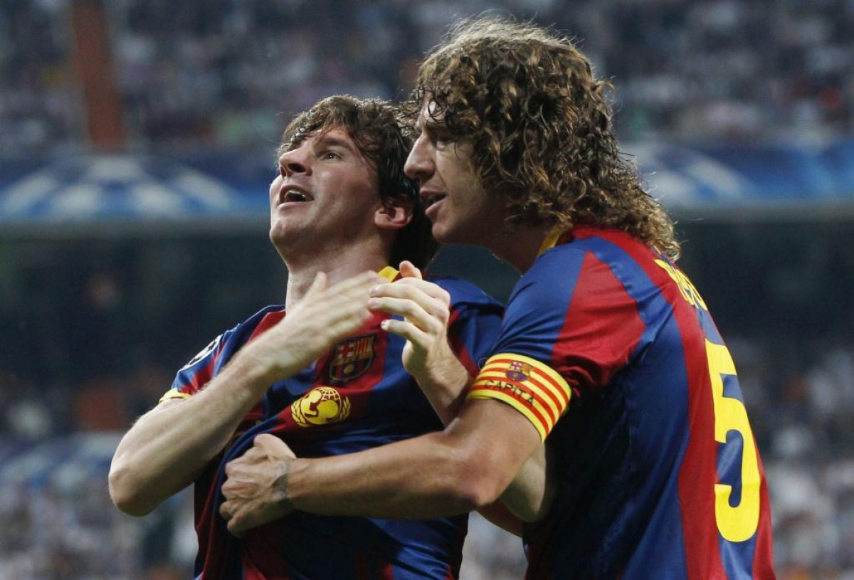 Messi i Puyol, celebrant un gol