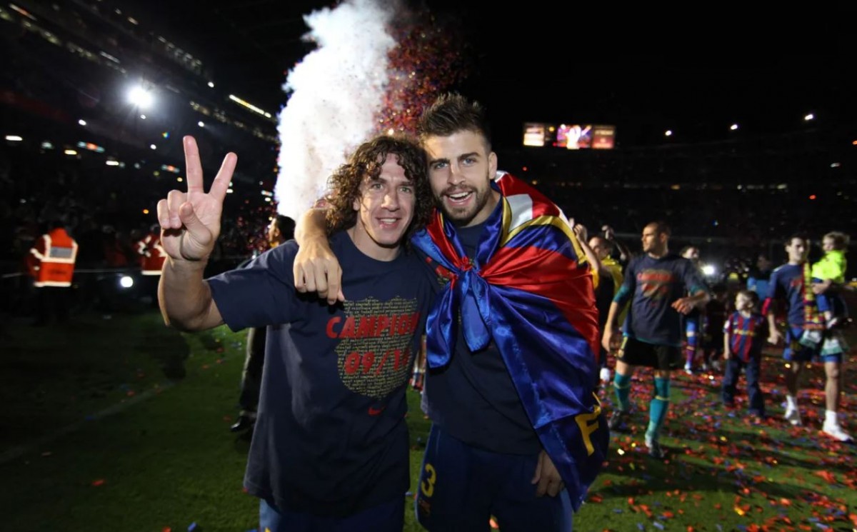 Carles Puyol i Gerard Piqué, celebrant un títol