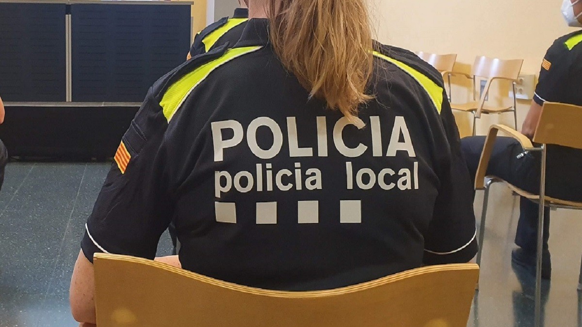 Agent de la policia local.